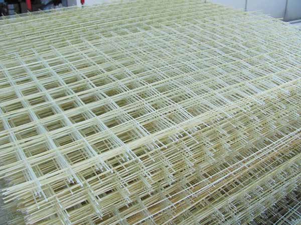 Flat fiberglass mesh panels stacked ready for installation